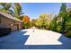 Spacious three-car garage with a large driveway and basketball court at 9680 Almaviva Dr, Alpharetta, GA 30022
