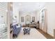 Bright home office features a comfortable couch and large desk at 9680 Almaviva Dr, Alpharetta, GA 30022