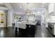 Modern kitchen with large island, stainless steel appliances, and dark hardwood floors at 9680 Almaviva Dr, Alpharetta, GA 30022