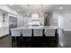 Elegant kitchen with a large island and modern light fixtures at 9680 Almaviva Dr, Alpharetta, GA 30022