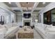 Bright and airy living room with two white sofas and a statement coffee table at 9680 Almaviva Dr, Alpharetta, GA 30022