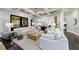 Spacious living room with hardwood floors and large windows at 9680 Almaviva Dr, Alpharetta, GA 30022