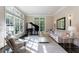 Sunlit living room with grand piano and plush seating at 9680 Almaviva Dr, Alpharetta, GA 30022
