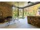 Covered patio overlooks a beautifully landscaped backyard at 9680 Almaviva Dr, Alpharetta, GA 30022