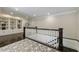 Elegant upper hall with built-in shelving and hardwood floors at 9680 Almaviva Dr, Alpharetta, GA 30022