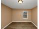 Spacious bedroom with neutral walls and wood-look flooring at 1881 Broad Ave, East Point, GA 30344