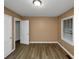 Bright bedroom with neutral walls and wood-look flooring at 1881 Broad Ave, East Point, GA 30344