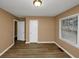 Bright bedroom with wood-look floors and neutral walls at 1881 Broad Ave, East Point, GA 30344