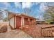 Brick house with covered patio and backyard at 1881 Broad Ave, East Point, GA 30344