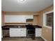 Updated kitchen features stainless steel appliances and new flooring at 1881 Broad Ave, East Point, GA 30344