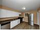 Kitchen with stainless steel appliances and wood flooring at 1881 Broad Ave, East Point, GA 30344