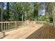 Wooden deck overlooking a spacious yard, ideal for outdoor entertaining and enjoying the natural surroundings at 1931 Oana Sw St, Atlanta, GA 30310