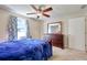 Comfortable bedroom features a ceiling fan, carpeted floors and natural light at 1931 Oana Sw St, Atlanta, GA 30310