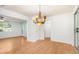 Spacious dining room features hardwood floors, a decorative chandelier and ample natural light at 1931 Oana Sw St, Atlanta, GA 30310