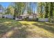 Charming home featuring a well-manicured lawn and a cozy, screened-in front porch at 1931 Oana Sw St, Atlanta, GA 30310