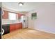 Kitchen features stainless steel appliances, wood cabinets, and durable laminate flooring at 1931 Oana Sw St, Atlanta, GA 30310