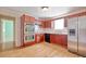 Well-equipped kitchen with stainless steel appliances, wood cabinets, and durable laminate flooring at 1931 Oana Sw St, Atlanta, GA 30310