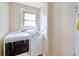 Convenient laundry room with a washer, dryer, and a window for natural light at 1931 Oana Sw St, Atlanta, GA 30310