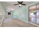 Inviting living room with plush carpet, natural light, and a view to the chandelier at 1931 Oana Sw St, Atlanta, GA 30310