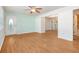 Bright living room with hardwood floors, a ceiling fan, and an open doorway to the dining area, perfect for entertaining at 1931 Oana Sw St, Atlanta, GA 30310
