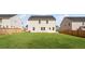 Spacious backyard offers ample space and a private fence, backing up to other homes at 236 Begonia Way, Mcdonough, GA 30253