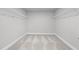 Walk-in closet with wire shelving, neutral walls and carpet at 236 Begonia Way, Mcdonough, GA 30253