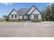 Community clubhouse has ample parking and manicured landscaping at 236 Begonia Way, Mcdonough, GA 30253