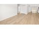Bright living room with light wood floors and access to other rooms at 4400 Ross Estates Ct, Snellville, GA 30039