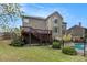 Well-maintained backyard with a wooden deck, privacy fence, and views of the swimming pool at 5669 Hollowbrooke Nw Ln, Acworth, GA 30101