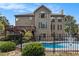 Spacious backyard with a swimming pool, deck and patio area surrounded by mature trees at 5669 Hollowbrooke Nw Ln, Acworth, GA 30101