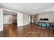 Finished basement area with hardwood floors, drop ceiling, and a door leading to another room at 5669 Hollowbrooke Nw Ln, Acworth, GA 30101