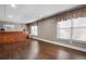 Finished basement area with hardwood floors, a wet bar, drop ceiling, and window with blinds at 5669 Hollowbrooke Nw Ln, Acworth, GA 30101