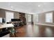 Finished basement area with three windows, a drop ceiling, and hardwood floors at 5669 Hollowbrooke Nw Ln, Acworth, GA 30101