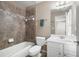 Bathroom features tile shower, modern vanity and tile floors at 5669 Hollowbrooke Nw Ln, Acworth, GA 30101