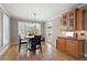 Bright breakfast nook with hardwood floors, ample natural light, and backyard access at 5669 Hollowbrooke Nw Ln, Acworth, GA 30101