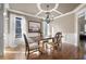 Elegant dining room features tray ceiling, hardwood floors, and custom trim work at 5669 Hollowbrooke Nw Ln, Acworth, GA 30101