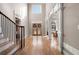 Grand foyer with hardwood floors, staircase, and abundant natural light at 5669 Hollowbrooke Nw Ln, Acworth, GA 30101