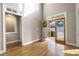 Bright and airy foyer showcasing hardwood floors, open doorway and a view of the front yard at 5669 Hollowbrooke Nw Ln, Acworth, GA 30101