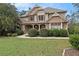 Attractive two-story home featuring a stone and siding facade, lush green lawn, and manicured landscaping at 5669 Hollowbrooke Nw Ln, Acworth, GA 30101