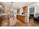 Open concept kitchen with granite countertops, stainless steel appliances, and hardwood flooring at 5669 Hollowbrooke Nw Ln, Acworth, GA 30101