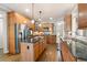 Well-equipped kitchen with stainless steel appliances, granite countertops, and center island at 5669 Hollowbrooke Nw Ln, Acworth, GA 30101