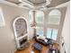 Aerial view of a bright living room with fireplace and leather furniture at 5669 Hollowbrooke Nw Ln, Acworth, GA 30101