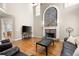 Bright living room showcasing the stone fireplace and open layout at 5669 Hollowbrooke Nw Ln, Acworth, GA 30101