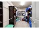 Walk-in closet features extensive built-in shelving and drawers for optimal organization at 5669 Hollowbrooke Nw Ln, Acworth, GA 30101
