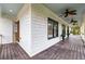 Spacious deck with white siding, ceiling fan, and access to exterior door at 1079 Wimberly Road Ne, Atlanta, GA 30319