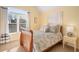 Cozy bedroom with a wooden bed frame and window at 5114 Parkwood Oaks Ln, Mableton, GA 30126