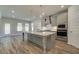 Modern kitchen with stainless steel appliances and island at 62 Homesite Cooper W Cv, Fayetteville, GA 30215