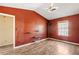 Spacious bedroom with wood-look floors and built-in shelves at 9119 Fairway Ct, Riverdale, GA 30274