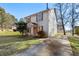 Front view of house showcasing driveway and yard at 9119 Fairway Ct, Riverdale, GA 30274