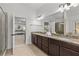 Bathroom with double vanity and view into main bedroom at 1345 Hilltop Overlook Dr, Marietta, GA 30062